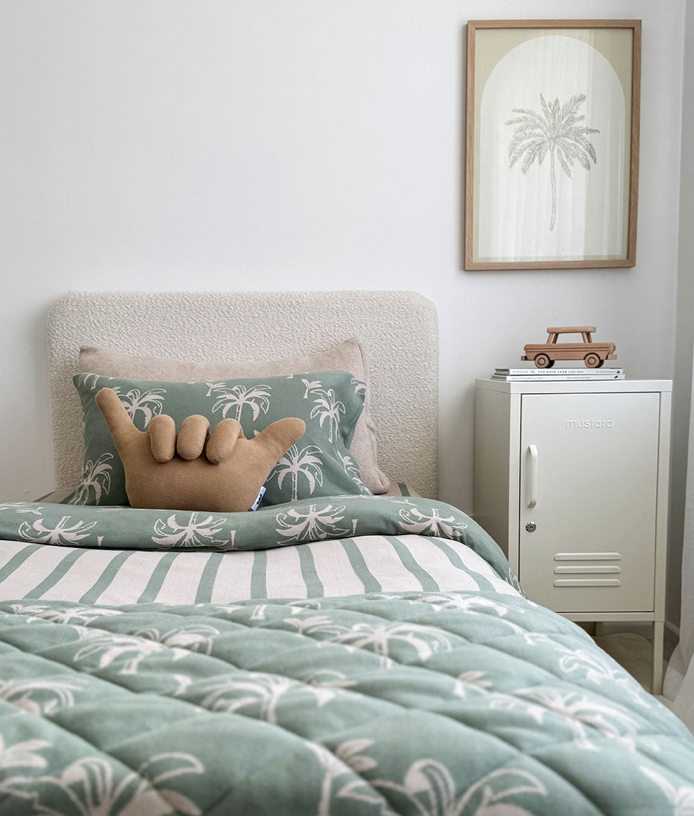 Mineral green and beige striped and palm tree coastal bedding with matching pillows