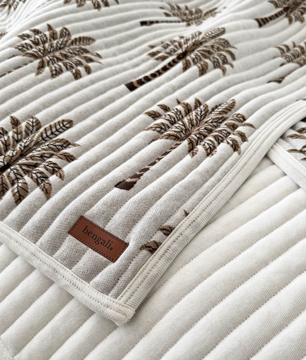Close-up of the Khaki Sundown reversible quilt with Bengali leather label.