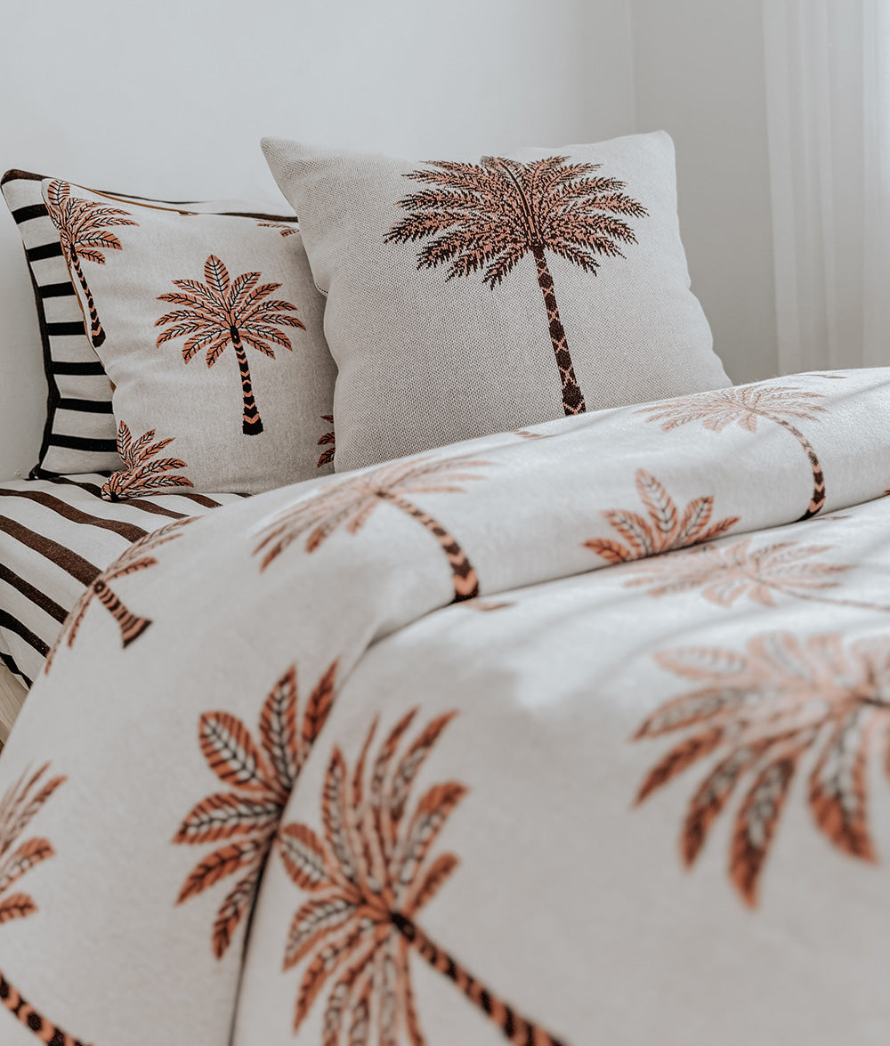 Peach Sundown jersey cotton duvet cover styled on a child's bed.