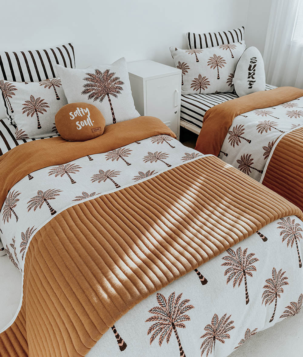 Sundown Stripe Euro pillowcase styled with Peach Sundown bedding.