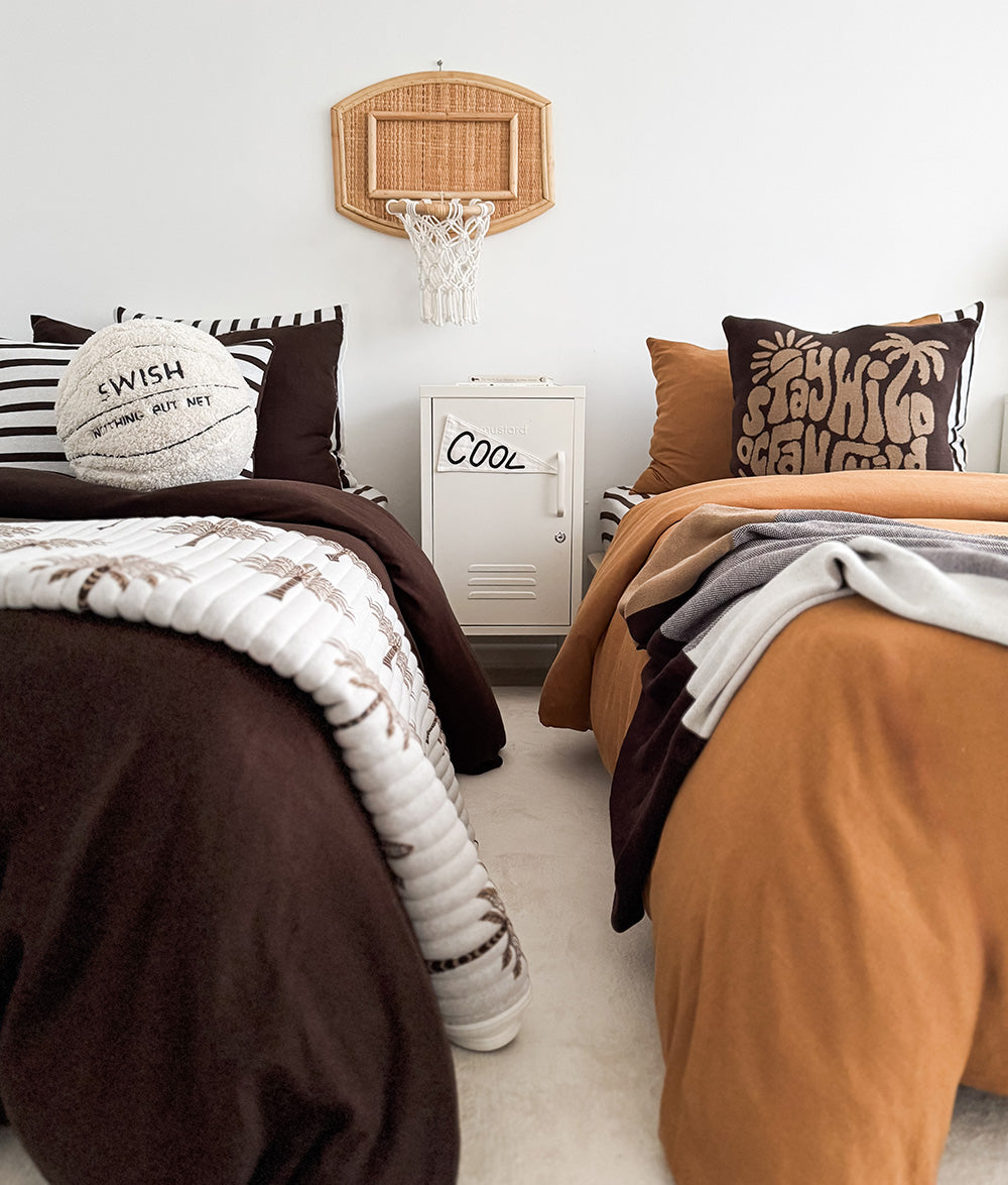 Sherpa basketball play cushion styled with coordinating bedding.