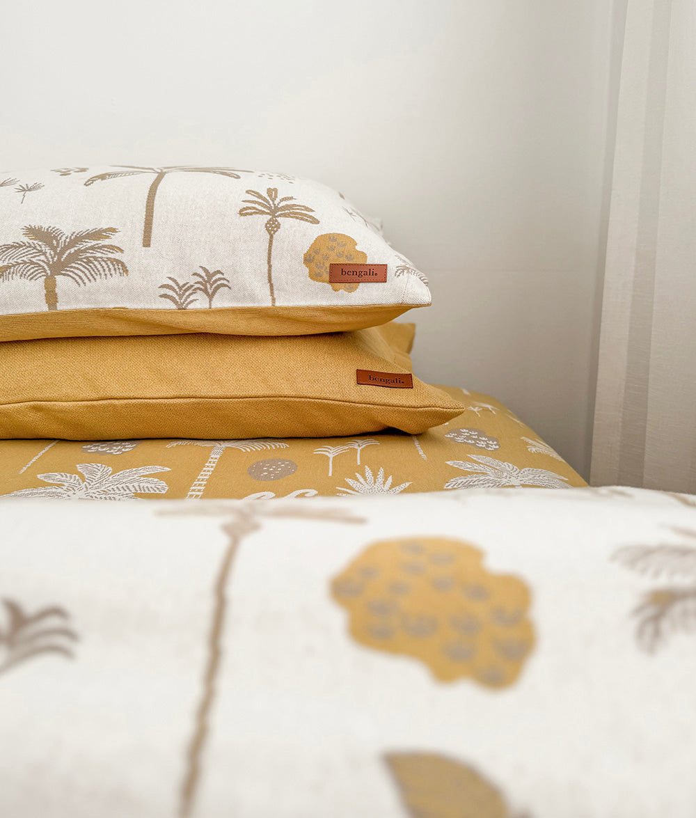 Folded Golden Hour jersey cotton duvet cover with matching pillowcases.