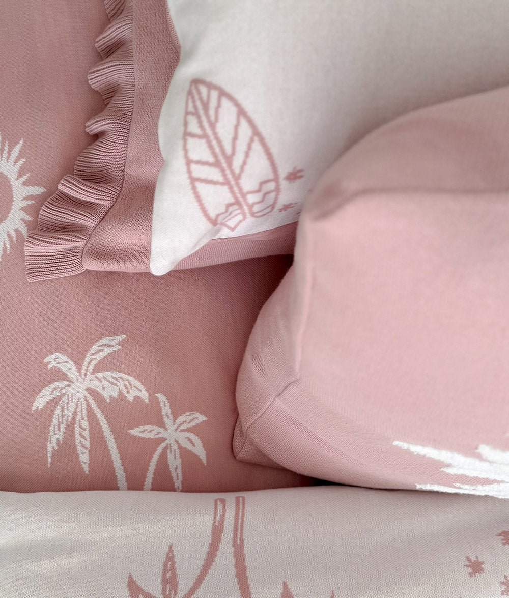 Child resting with the "Bare Feet Salty Hair" reversible pillowcase.