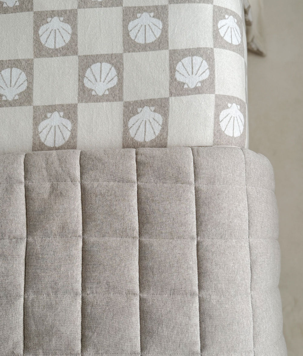 Textile with shell pattern and quilted texture