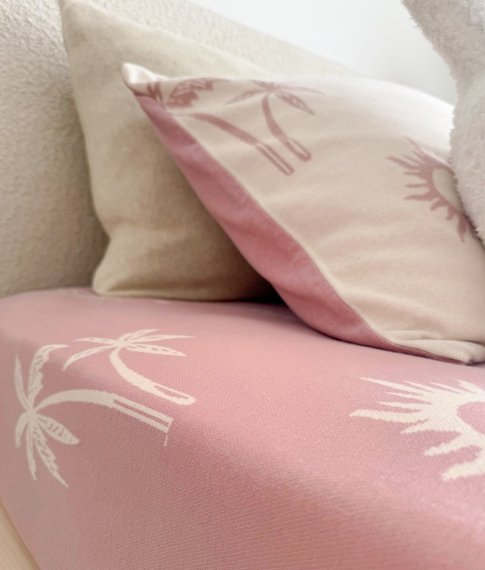 Sun Kissed reversible pillowcase styled with matching jersey cotton bedding.