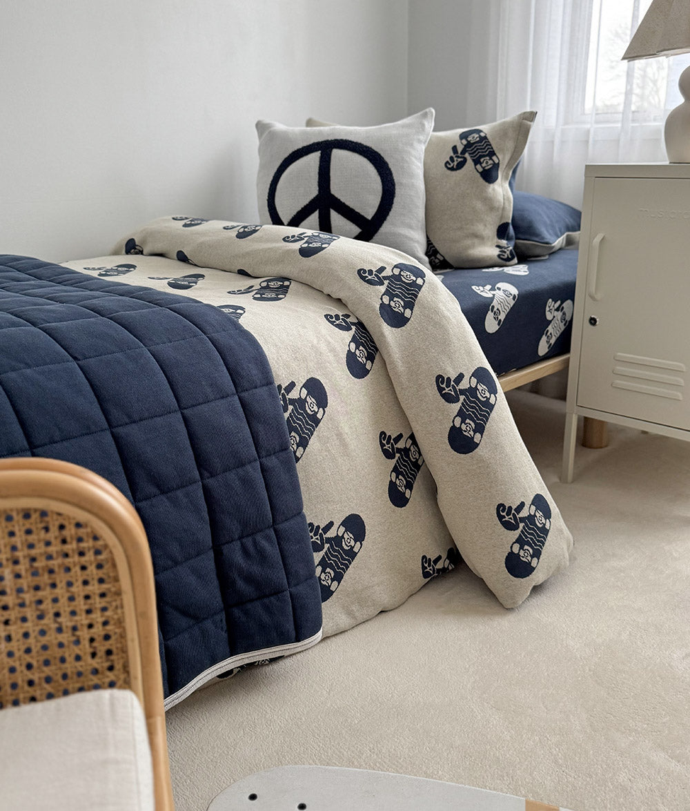 Tidal Blue Skater Life jersey cotton fitted sheet styled in a child's bedroom.