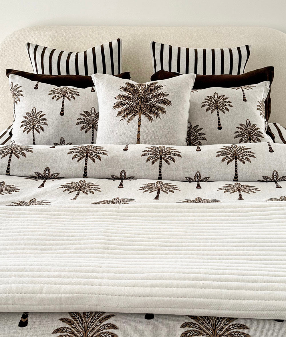 "Sundown." pillowcase styled with matching Khaki Sundown bedding.