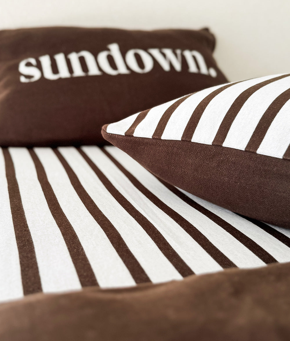 Khaki Sundown jersey cotton duvet cover with the "Sundown" cushion.