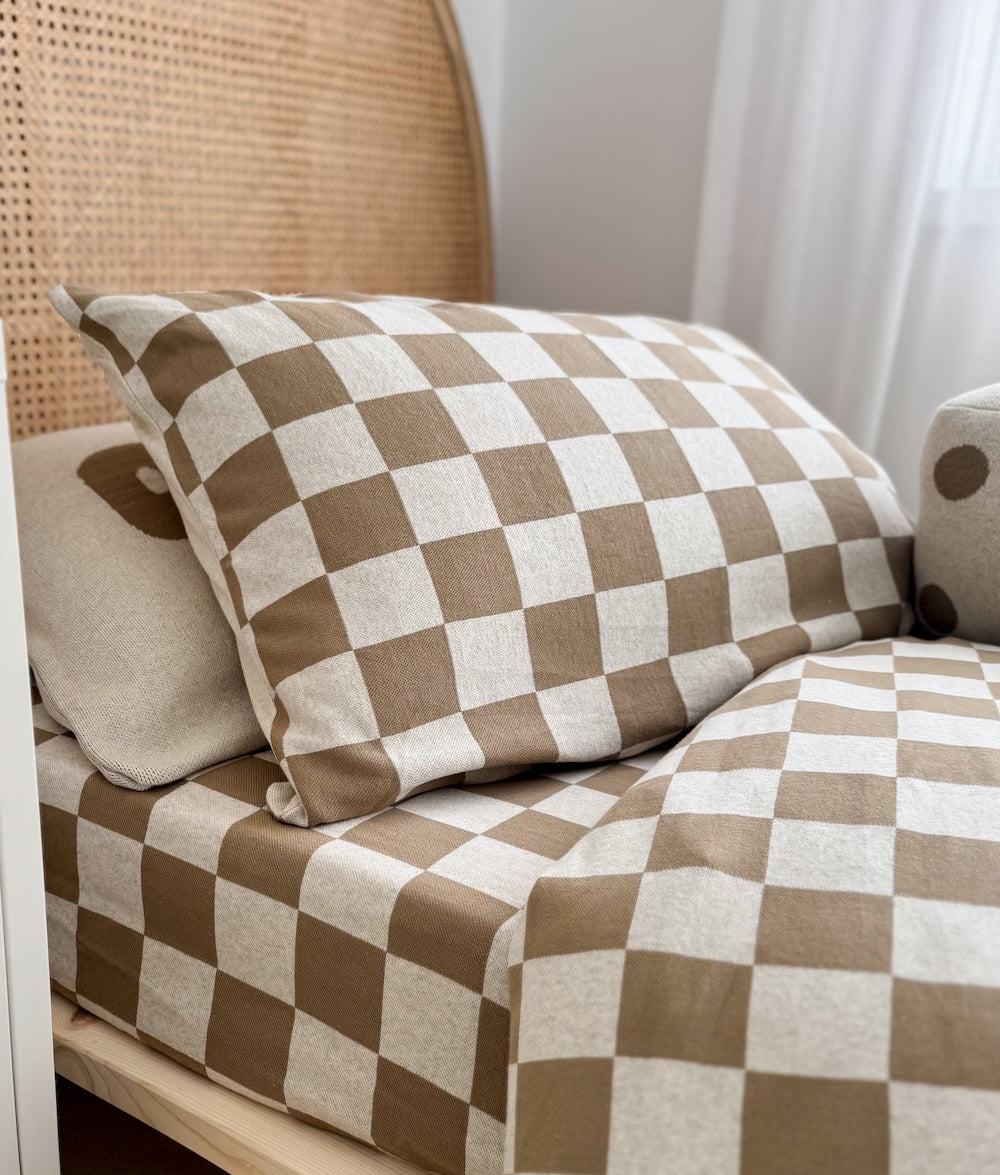 Styled bedroom featuring the Khaki Gingham duvet cover and coordinating quilt.