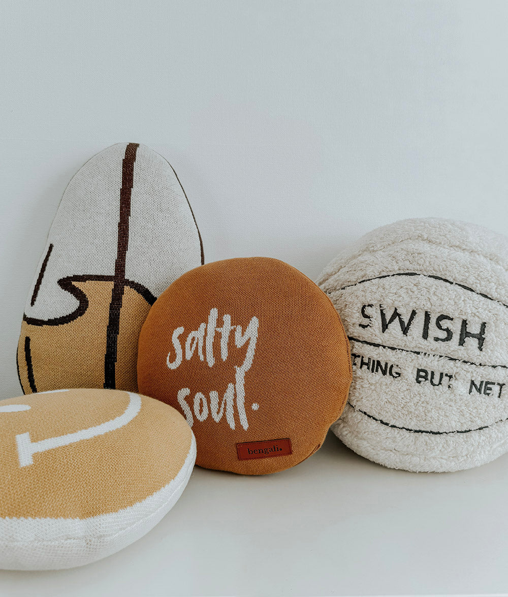 Sherpa basketball play cushion styled with matching kids' cushions.