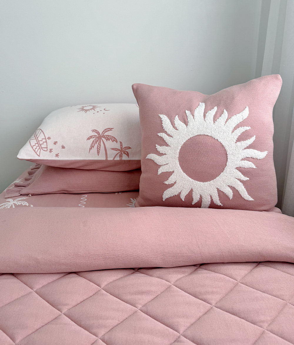 Pink Sol cushion cover with matching Sun Kissed quilt.