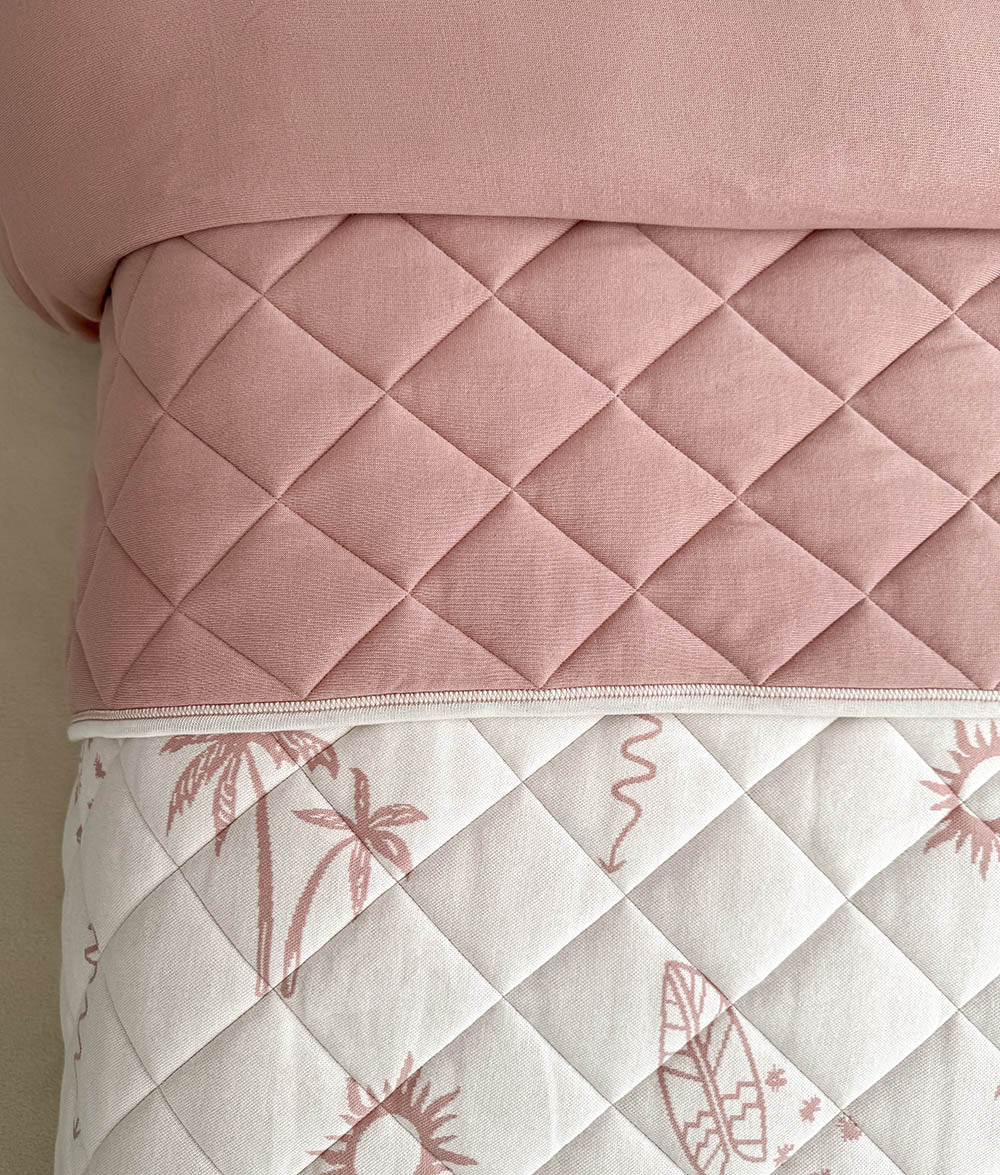 Close-up of the Sun Kissed reversible quilt showing both reversible designs.