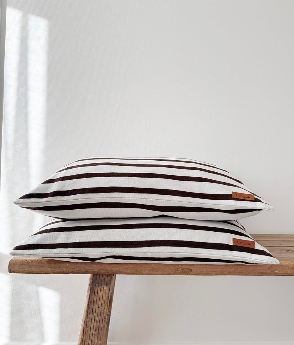Sundown Stripe reversible pillowcases with chocolate and ivory stripes.
