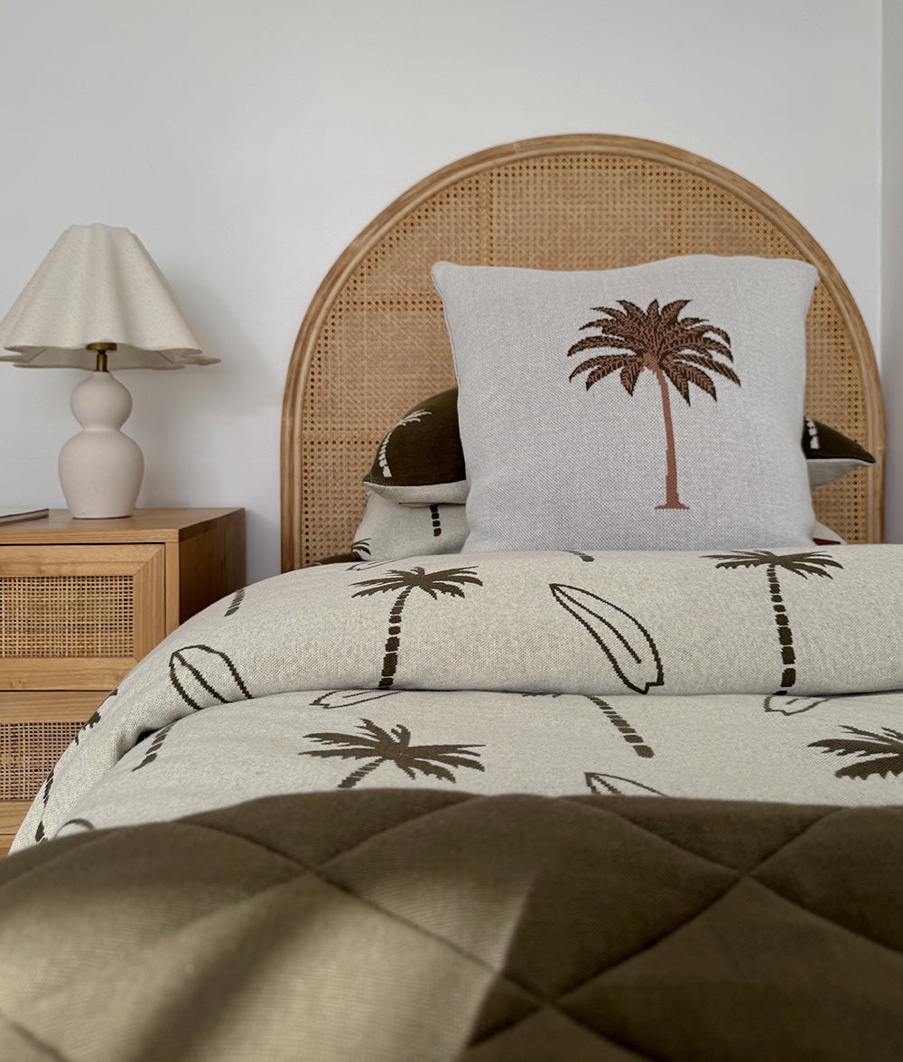 Olive Palm Motif cushion cover styled in a child's bedroom.
