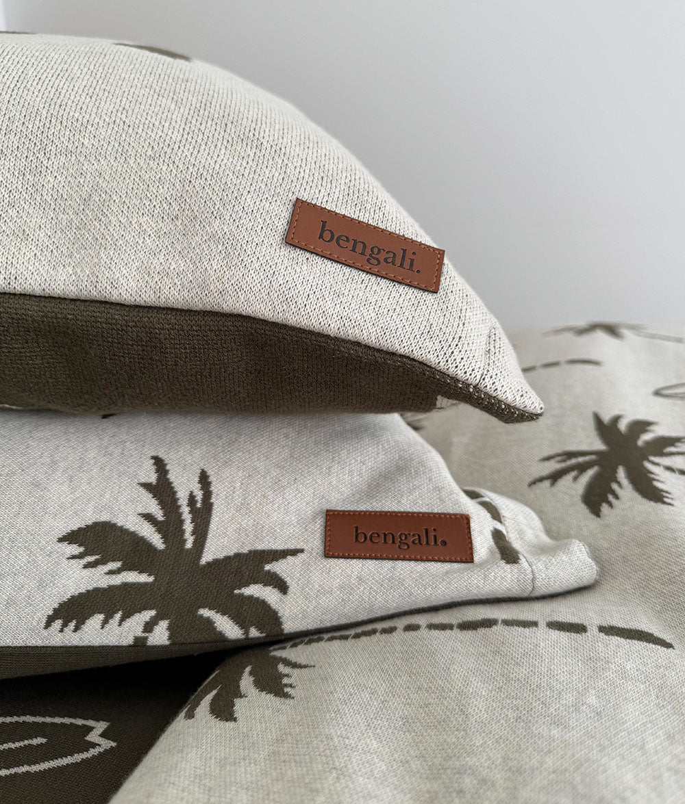 Close-up of the Olive & Natural Marle "bruh." reversible pillowcase with Bengali leather label.