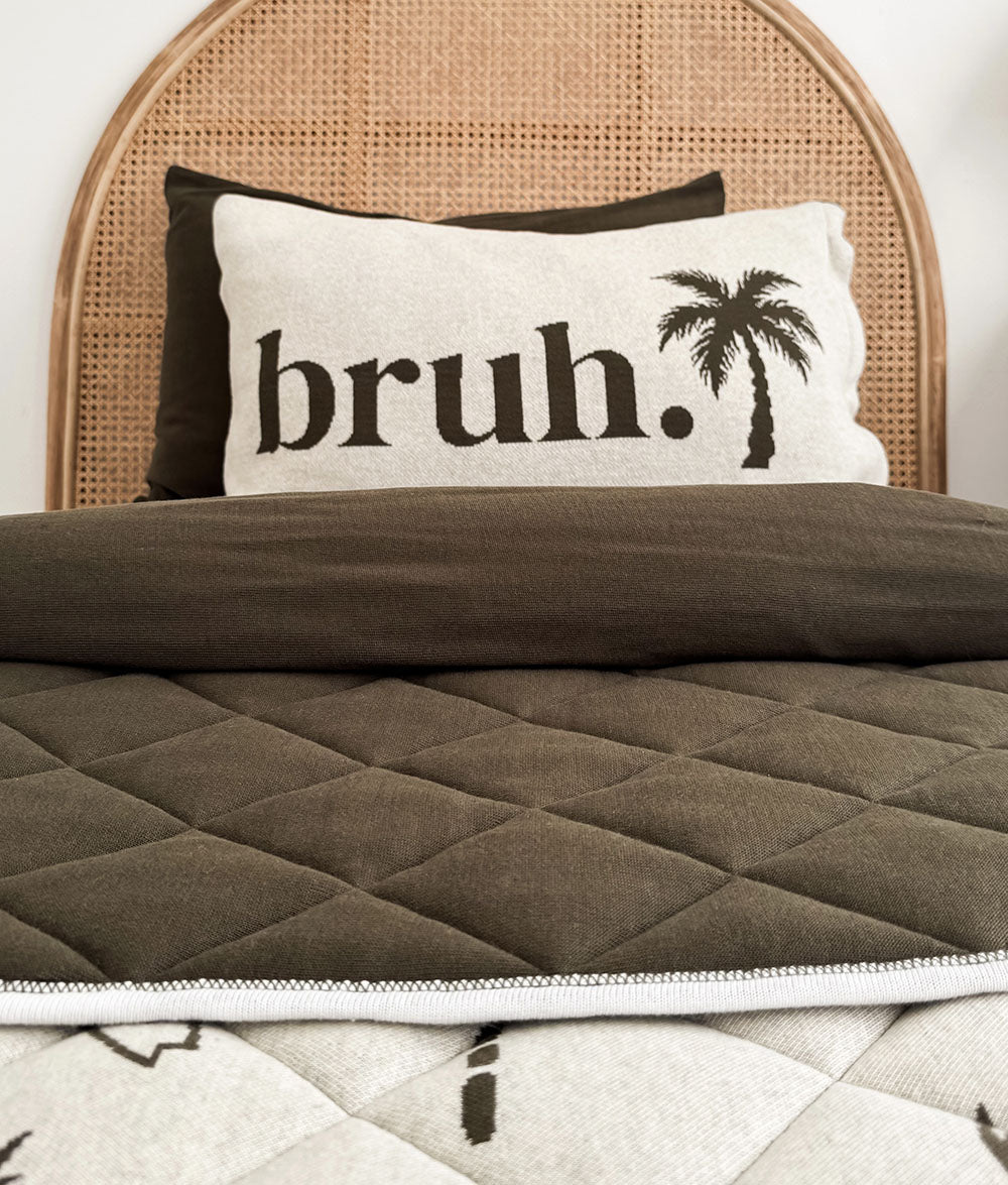 Olive & Natural Marle "bruh." reversible pillowcase with palm tree reverse.
