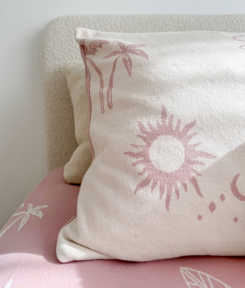Close-up of the Sun Kissed reversible pillowcase with Sun cushion.