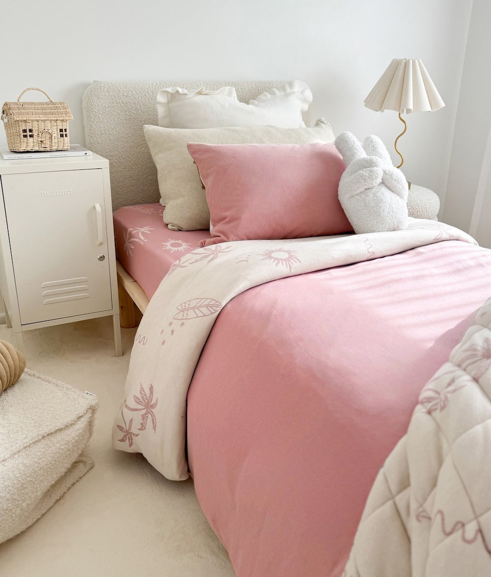 Sun Kissed jersey cotton duvet cover styled on a made bed.