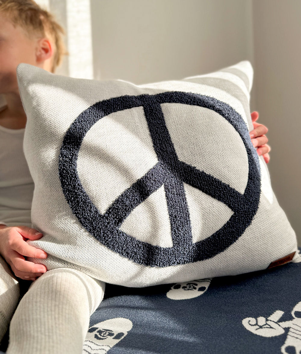 Peace cushion cover styled with Tidal Blue Skater Life bedding.