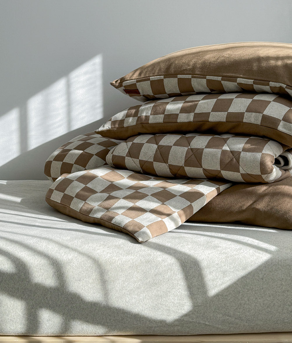 Layered Khaki Gingham quilt styled with matching duvet cover and pillowcases.